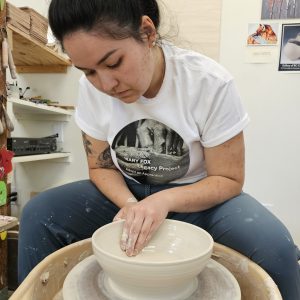 Sabrina throwing on the wheel